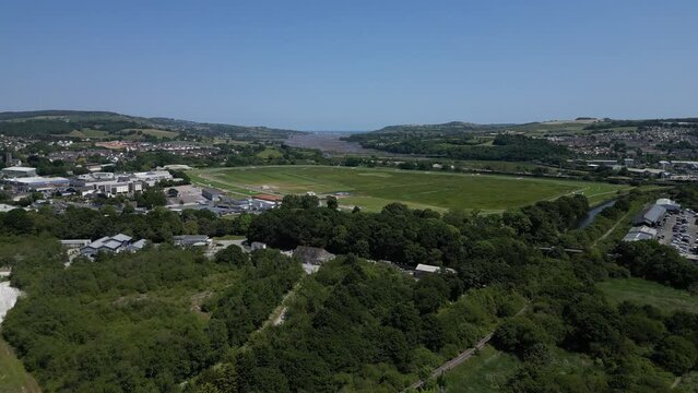Newton Abbot, South Devon, England: DRONE VIEWS: The drone ascends for views of Newton Abbot racecourse and the River Teign in the foreground right and distance (Clip 4).