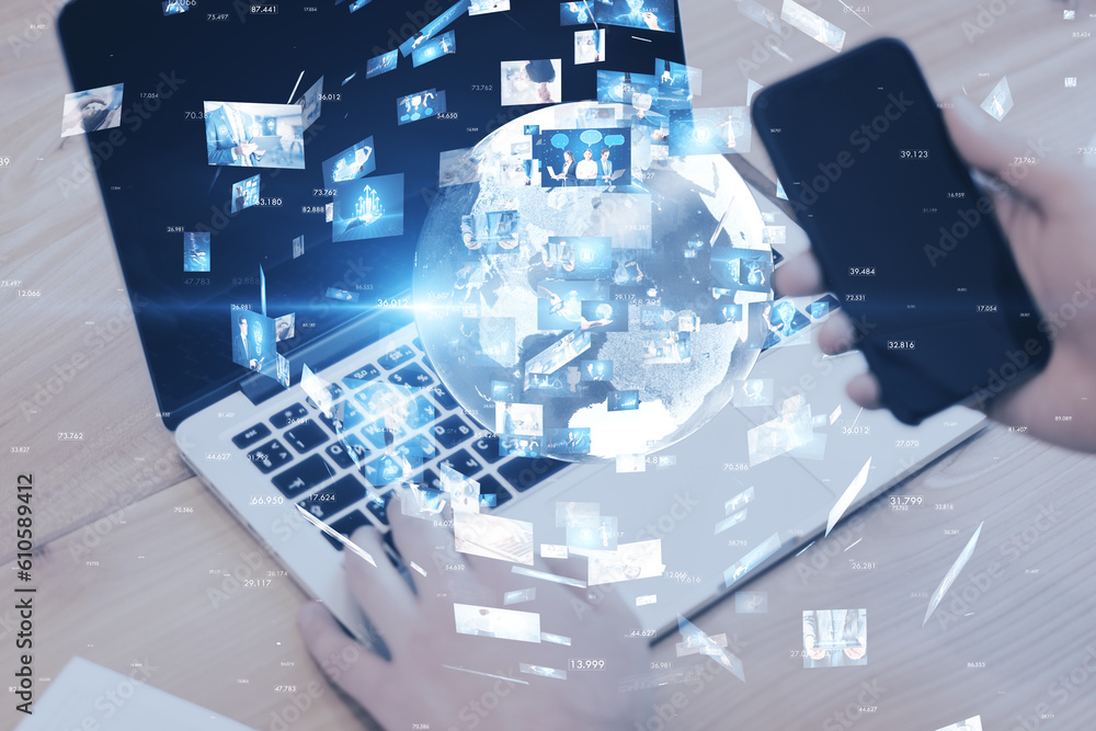 Poster close up of hands using laptop and cellphone with creative globe with telecommunication picture icon
