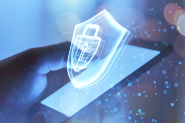 Data privacy, internet access and cyber security concept with keyhole inside closed padlock and shield hologram on man hand using modern smartphone background, double exposure