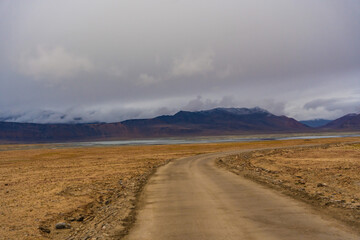  the road, mountain and cloud sky at Tanglang La pass in Ladakh, India, is the second highest...