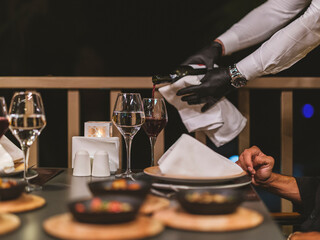 A waiter serves wine at the celebration