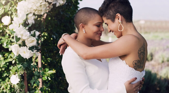love, hug and kiss with lesbian couple at wedding for celebration, gay and pride. Smile, spring and happiness with women at marriage event in garden for partner commitment, lgbtq and freedom