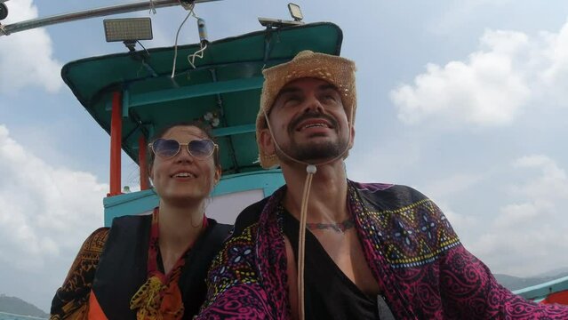 Couple Inside an speedboat thorugh the sea in Thailand