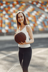 Sports girl in a uniform standing at the stadium