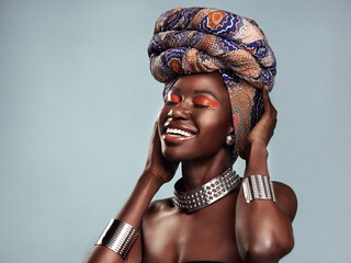 Beauty, black woman and smile with African head scarf and mockup in a studio. Isolated, blue...