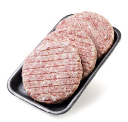 Raw meat cutlets in a package close-up on a white background.