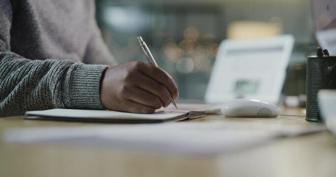 Notebook, writing and business man hands in office planning, brainstorming and schedule at night. Notes, journal and ideas or creative planner of person or worker at his desk for project or job goals