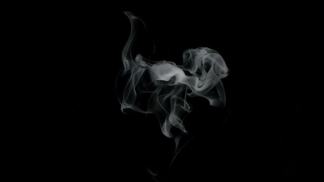 White smoke on a black background.  Top-Down Angle.
Slow motion. Shot in 4K resolution at 60fps.