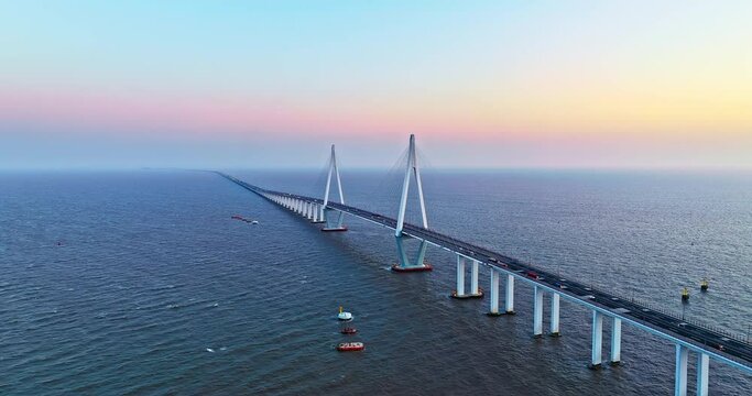 Aerial view of Hangzhou Bay Bridge scenery at sunset, Zhejiang Province, China. The total length of the bridge is 36 kilometers. The design speed is 100 kilometers per hour. 