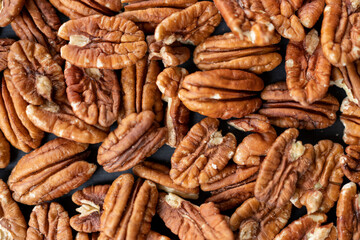 Pecan nuts background, pecan halves closeup