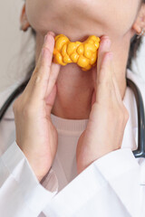 Doctor with human Thyroid anatomy model. Hyperthyroidism, Hypothyroidism, Hashimoto Thyroiditis,...