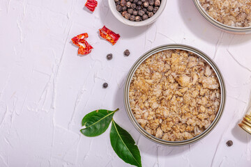 Tinned fish tuna in oil with spices and herbs. Healthy ingredient for vegetarian lifestyle. Seafood