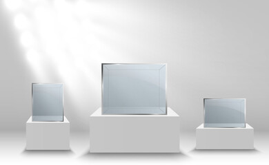 Glass showcase for the exhibition in the form of a cube. Background for sale illuminated by spotlights. Museum glass box isolated advertising or business design boutique. Exhibition hall.
