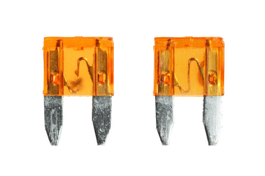 Blown and New Mini Fuses on white background macro view