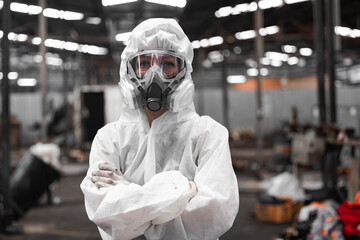 Industrial waste inspector wearing personal protective equipment to check hazardous chemicals,...
