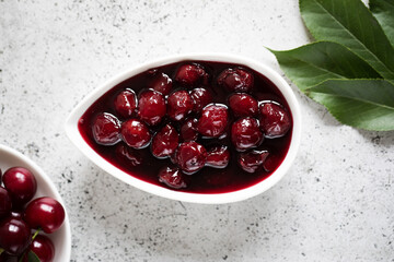 cherry jam and fresh cherries in a bowl, homemade preserves