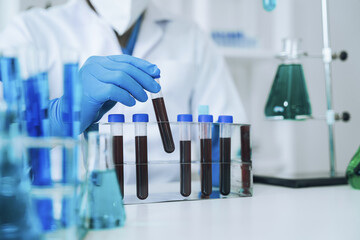 biotechnologist testing new chemical substances in a laboratory.