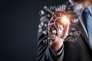 Businessman hand holding light bulb for ideas concept