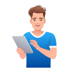 Handsome white young man holds a tablet computer in his hand. Internet surfing and working in a mobile application.