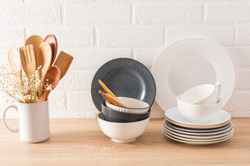 Stylish modern kitchen background. Eco-friendly items and utensils on the kitchen countertop. Cozy comfortable interior design.