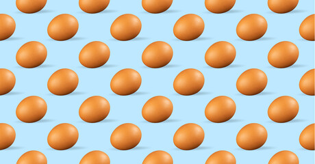 Seamless pattern of chicken eggs on blue background. Fresh repeating chicken eggs on blue background