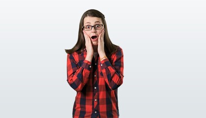 Shocked anxious young woman posing