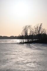 Vertical shot of a wintery seaside landscape during harsh light