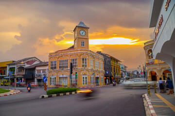 The Phuket Thailand , September 14th 2020 ; Landmark chino-portuguese clock tower in phuket old town, Thailand, with light trails on road in twilight time.