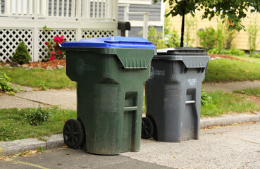 Trashcans symbolize waste management, cleanliness, responsible disposal, and the importance of...