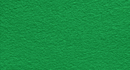 Poker table felt background in green color. Surface of fabric texture in green tone color..