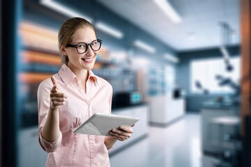 Portrait of a Beautiful smart Female Using digital Tablet Computer