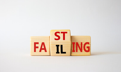 Fasting vs Failing symbol. Wooden cubes with words Failing and Fasting. Beautiful white background. Fasting vs Failing and business concept. Copy space