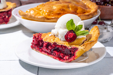 Homemade sweet cherry cake with vanilla ice cream ball. Slice of cherry pie topped with scoop of melting ice cream