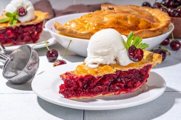 Homemade sweet cherry cake with vanilla ice cream ball. Slice of cherry pie topped with scoop of melting ice cream