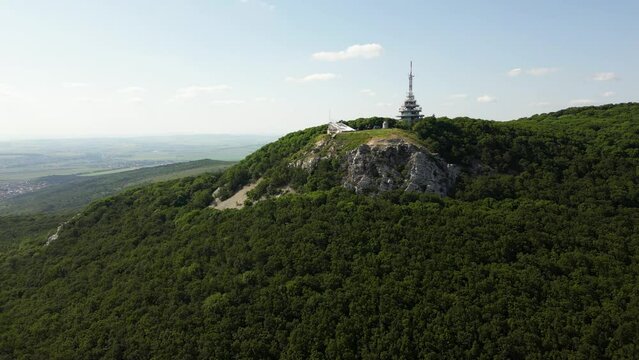 Beautiful aerial view of Zobor Mountain with a radio tower on top, Slovakia, 4k