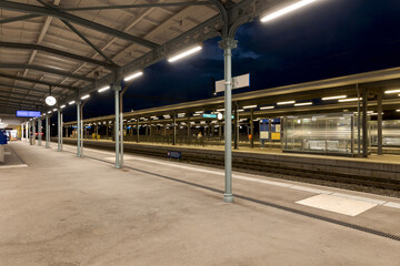 Covered station platform illuminated by led lights