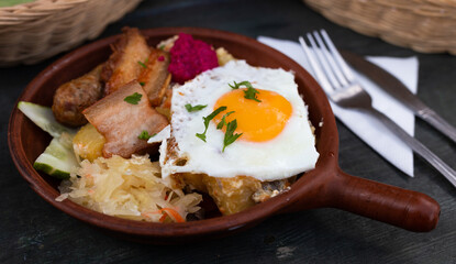 Breakfast dish - scrambled eggs with fried bacon