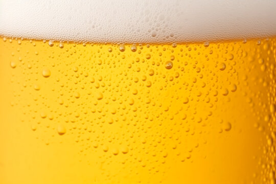 Close-up glass of cold beer with foam as texture and background, post-processed, generative ai