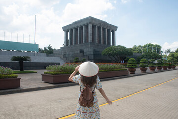 Woman traveller is sightseeing at Ho Chi Minh Mausoleum in Hanoi, Vietnam.	