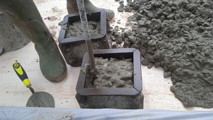 Sampling of concrete cubes at field construction sites - obrazy, fototapety, plakaty