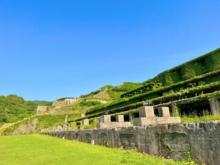 Fototapeta premium Mossy ruins of a gold ore sorting plant on Sado Island, Niigata, Japan.