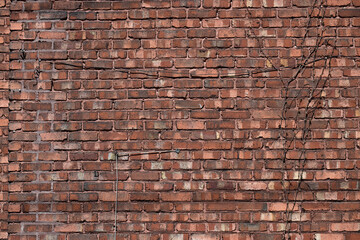 Cables on an old red brick wall