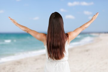 Fototapeta na wymiar Young Woman breathe and stretching on beach