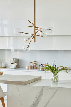 Vertical image of beautiful white kitchen with modern design
