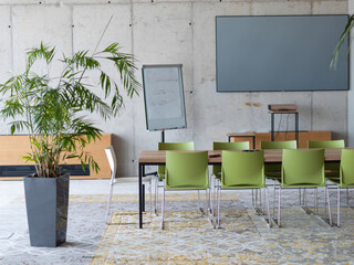 Interior of a business facility showcasing a well equipped office with a laptop and smartphones, reflecting a modern and efficient work environment.
