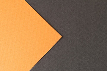 Rough kraft paper background, paper texture black orange colors. Mockup with copy space for text