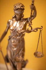 Themis and gavel in court library