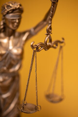 Themis and gavel in court library