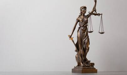 Fototapeta na wymiar Lady Justice and law books in court