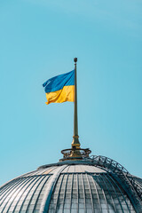 The dome of the Ukrainian parliament with the flag on the flagpole, Kyiv, Ukraine.